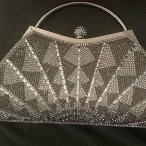 A silver clutch bag